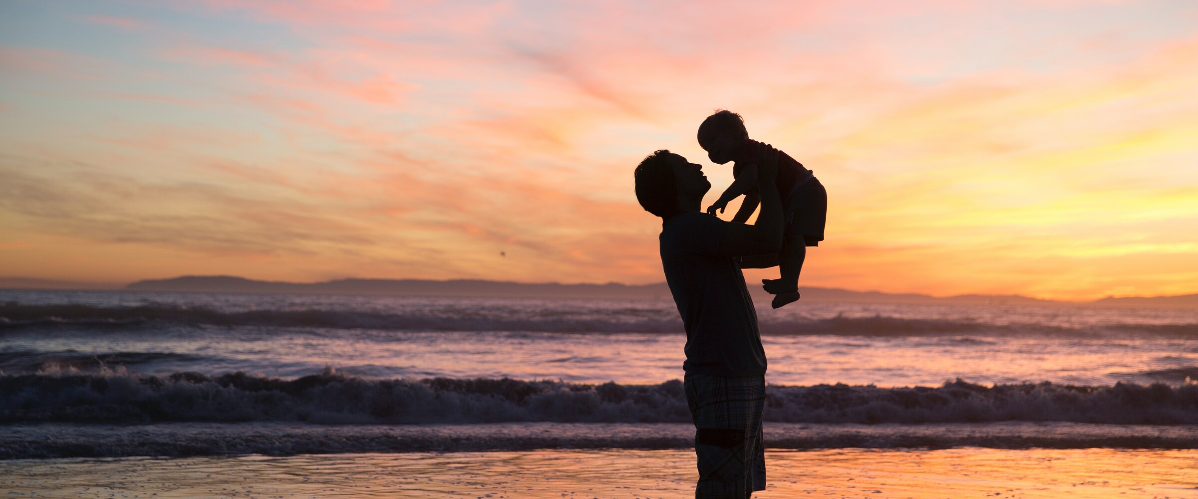 father and son on the beach
