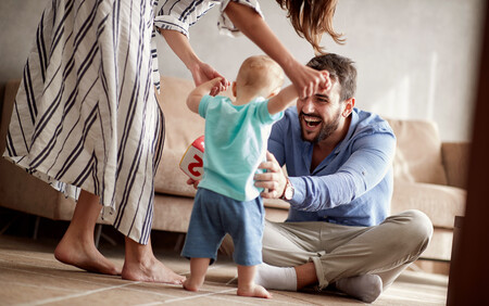 couple with baby running to them